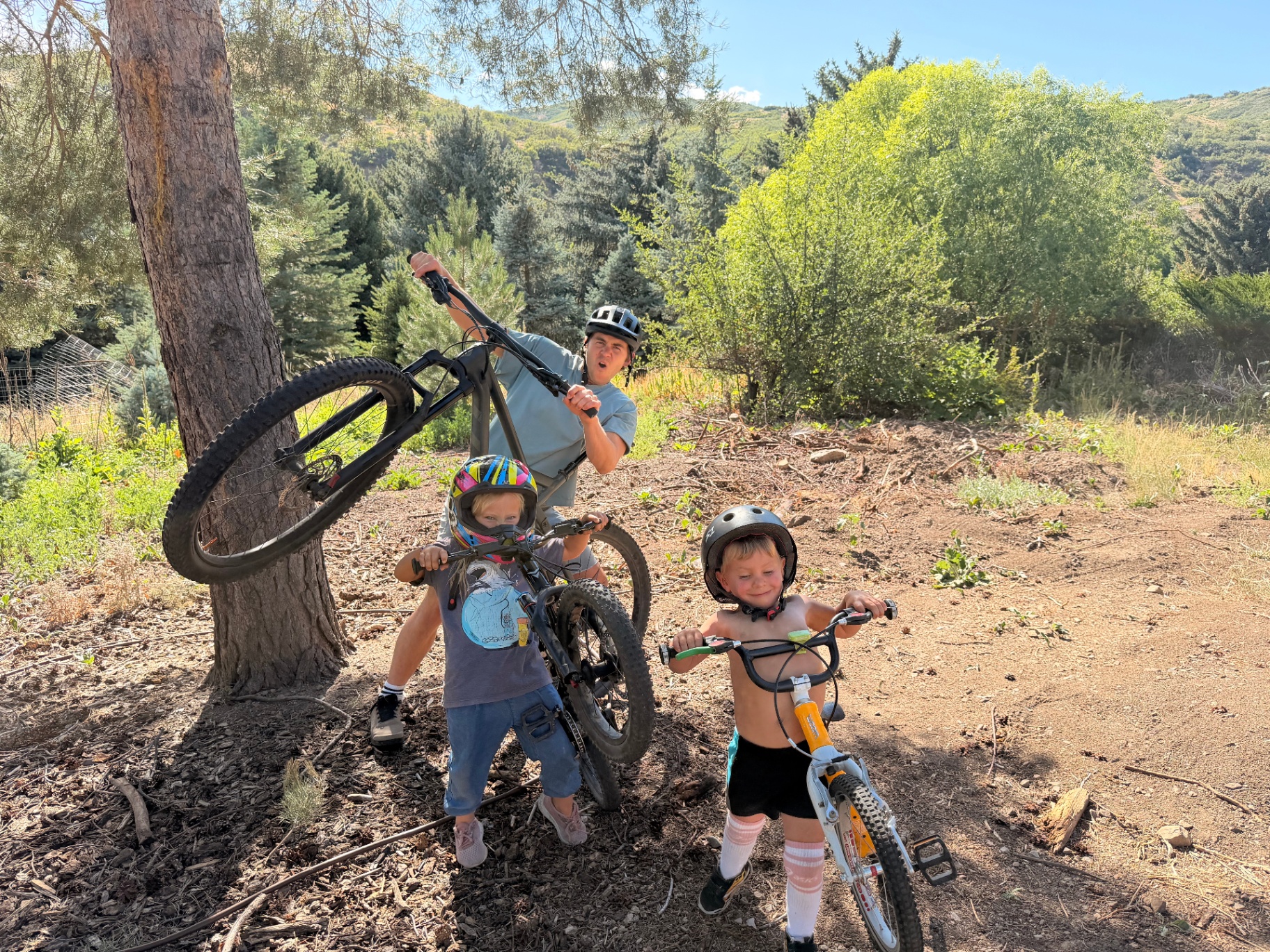 Kids and adult with bikes in the Alpine, Utah mountains